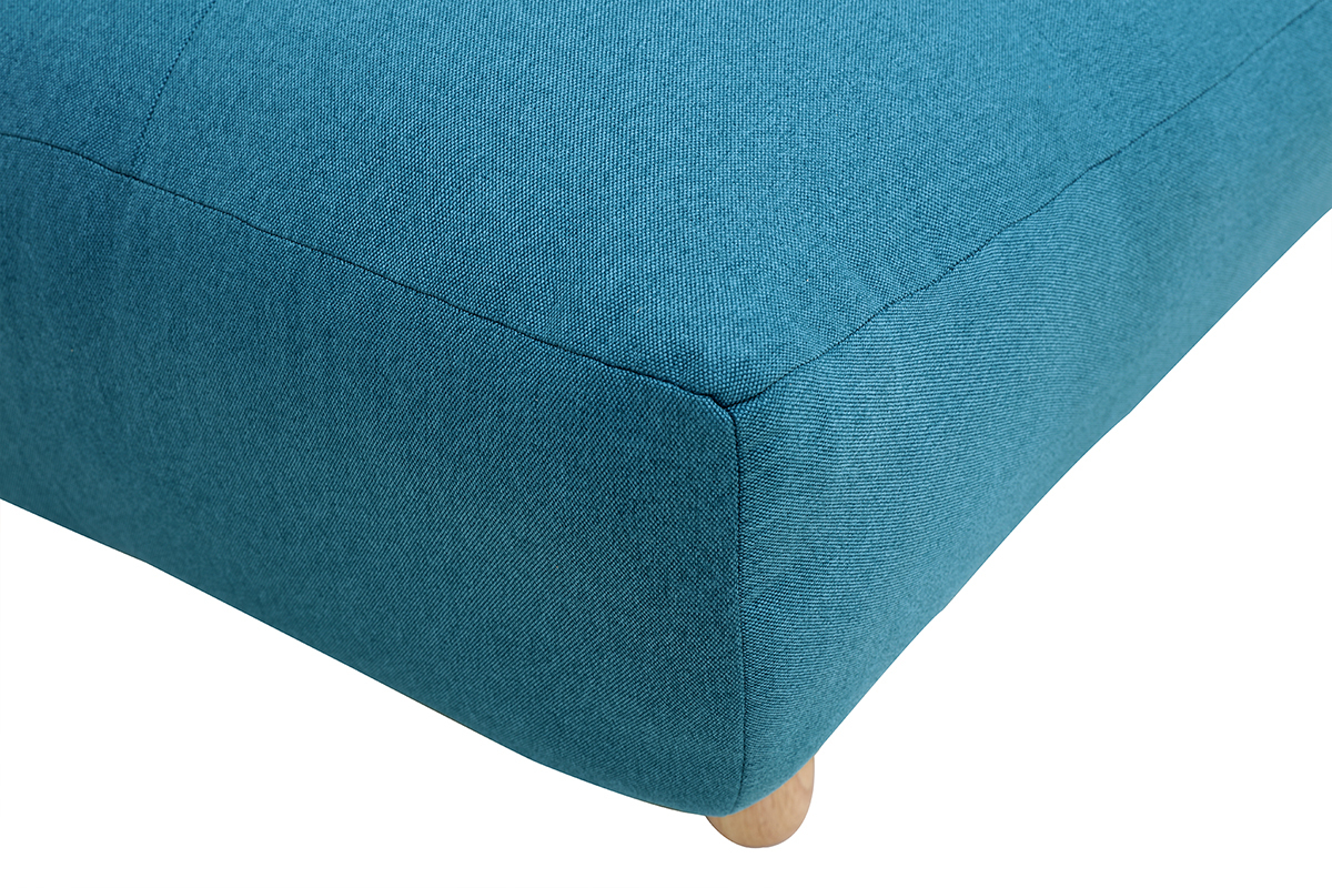 D�tail du coin du canap� convertible en tissu bleu canard avec pied en bois clair.