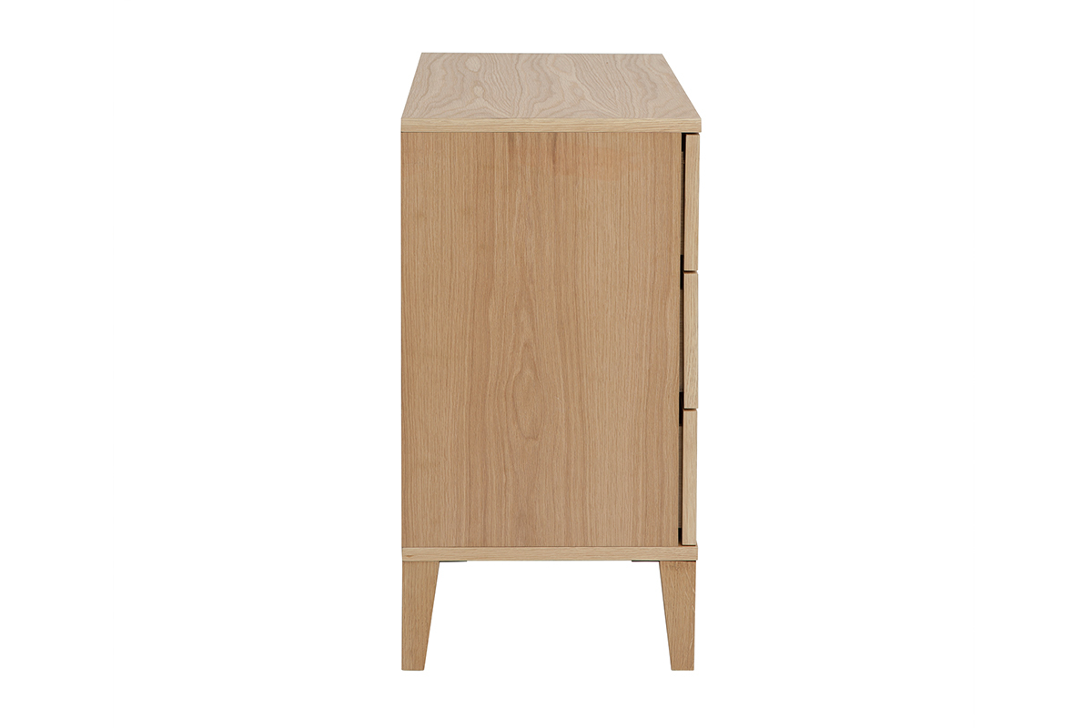 Commode en bois clair vue de profil, trois tiroirs, pieds fusel�s, style scandinave.
