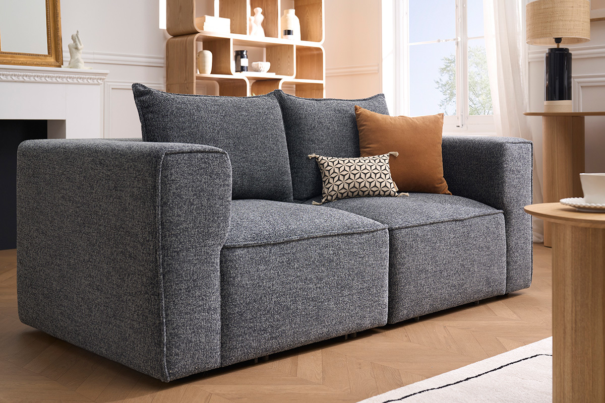 Module d'angle gauche KERRY en tissu gris, vue de 3/4 dans un salon moderne.